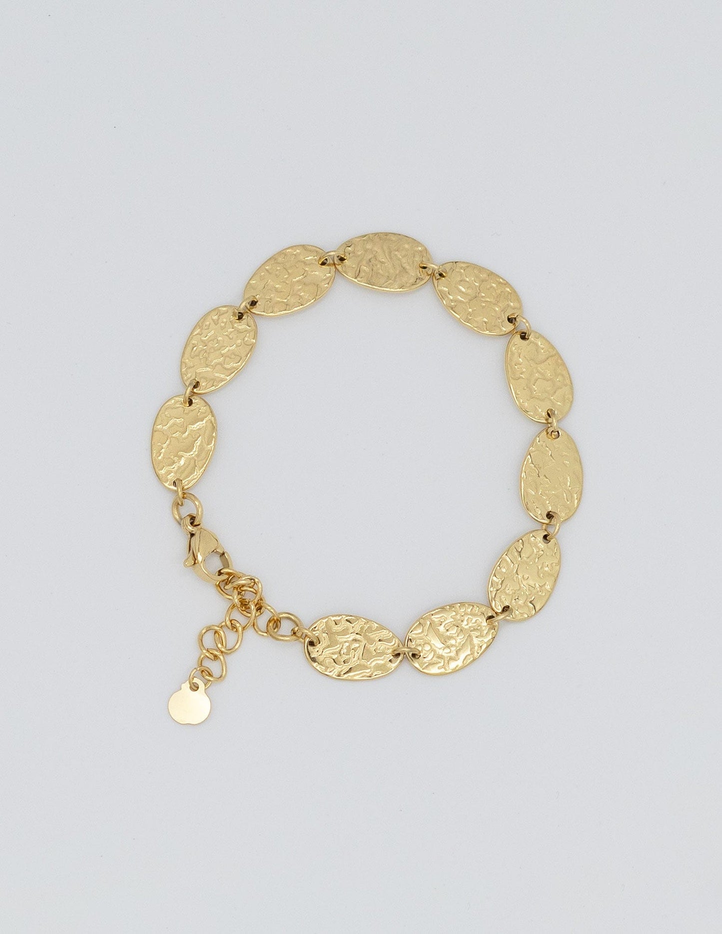 pulsera dorada con eslabones rellenos ovalados con textura maréele