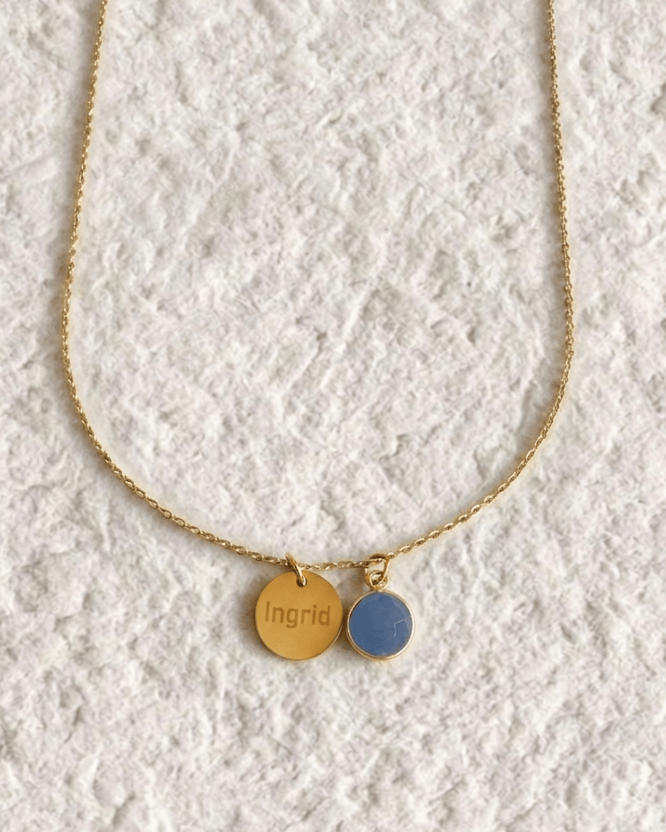 Necklace with engraved medal and natural stone