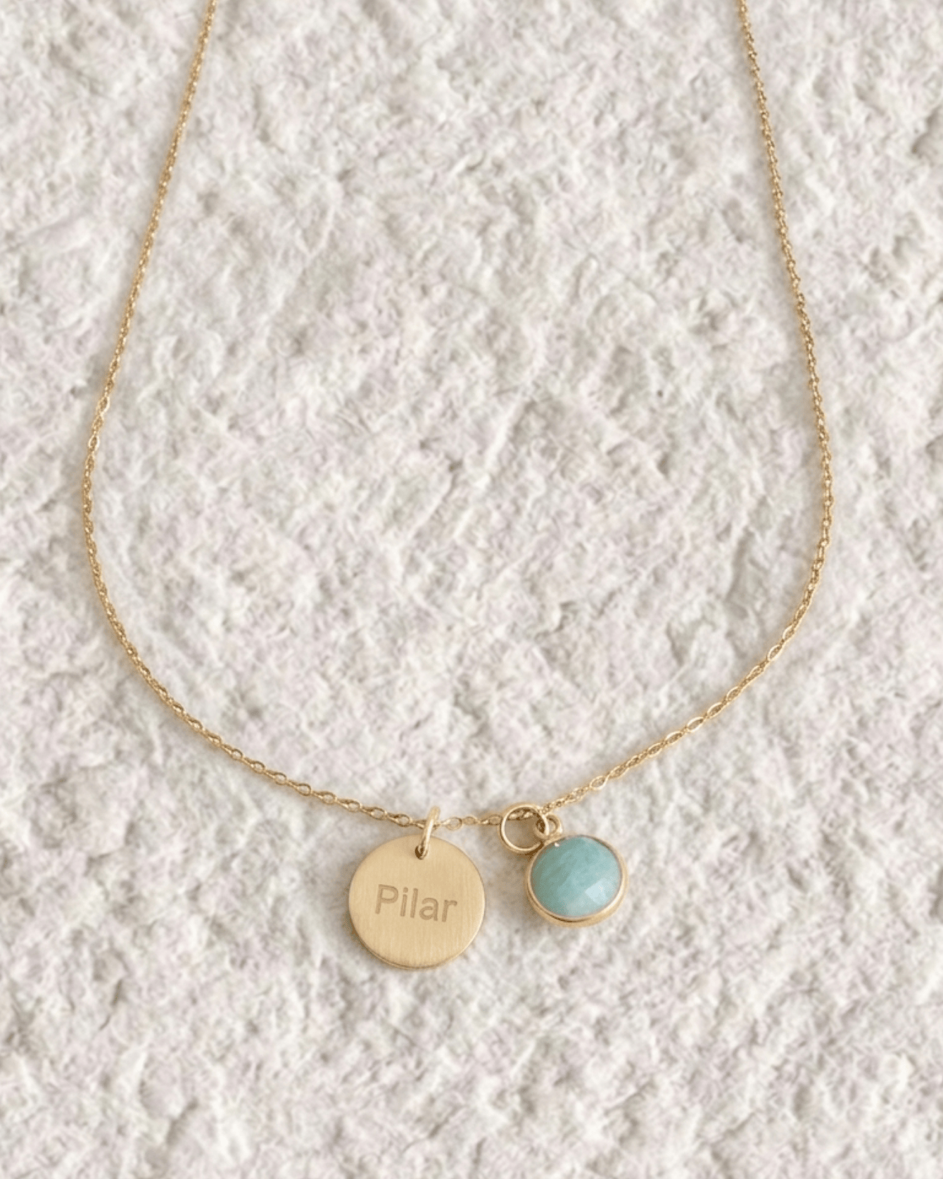 Necklace with engraved medal and natural stone
