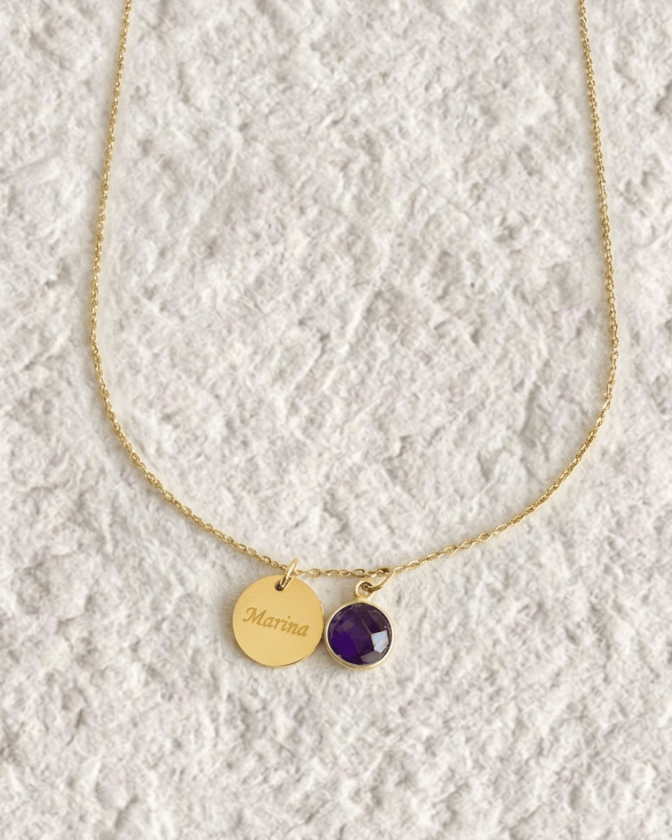 Necklace with engraved medal and natural stone