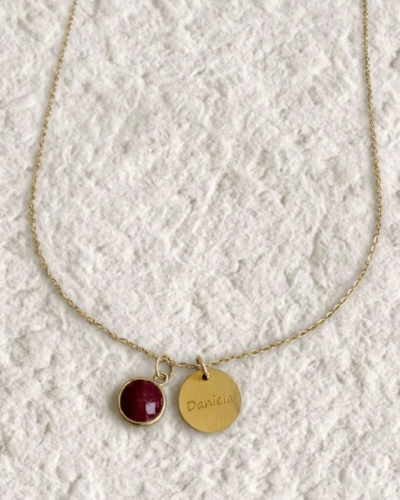 Necklace with engraved medal and natural stone
