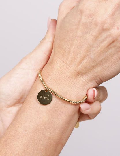 BRACELET WITH ENGRAVED MEDAL