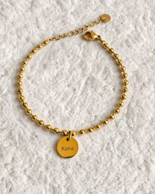 BRACELET WITH ENGRAVED MEDAL