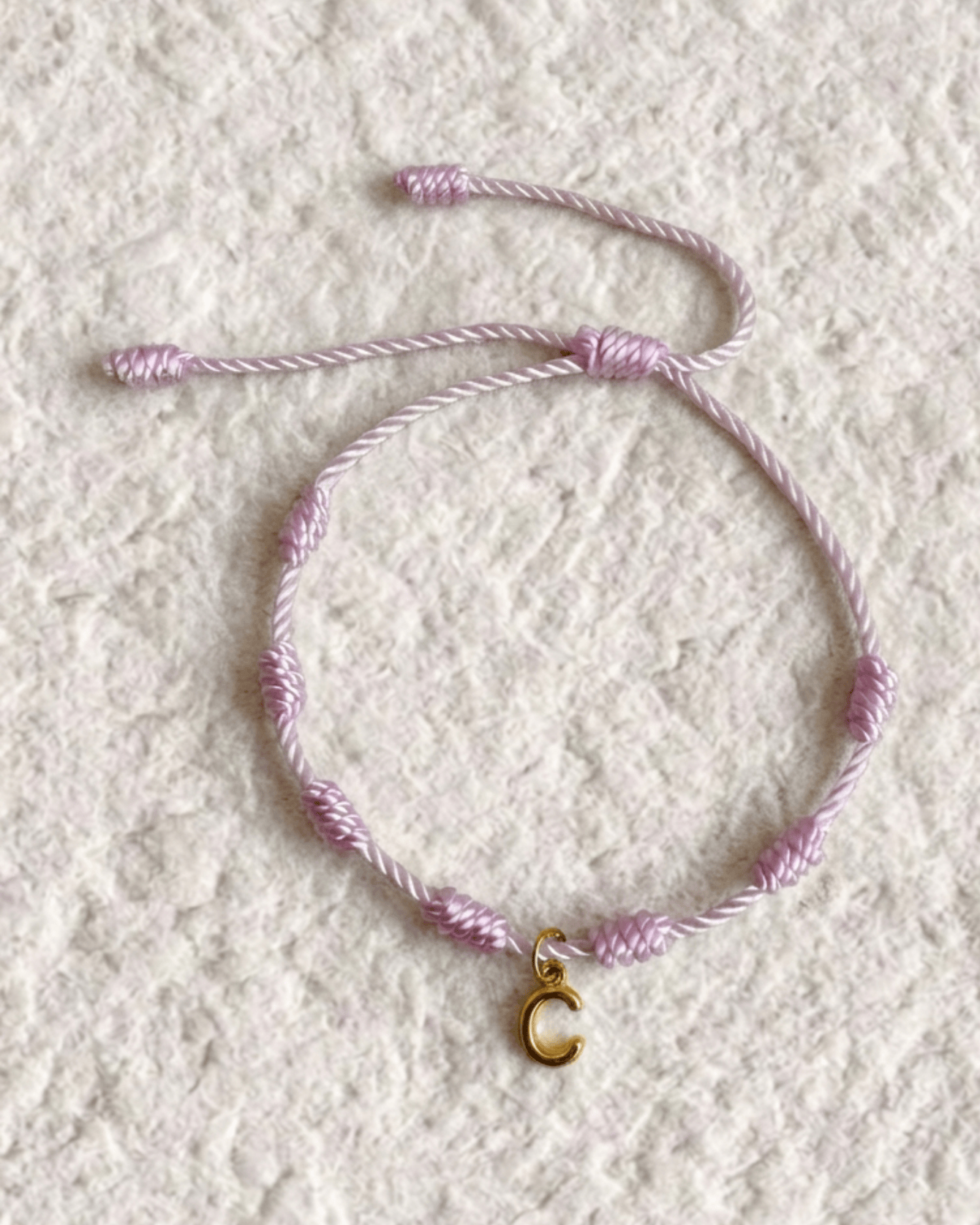 LUCKY KNOT BRACELET WITH ENGRAVED MEDAL