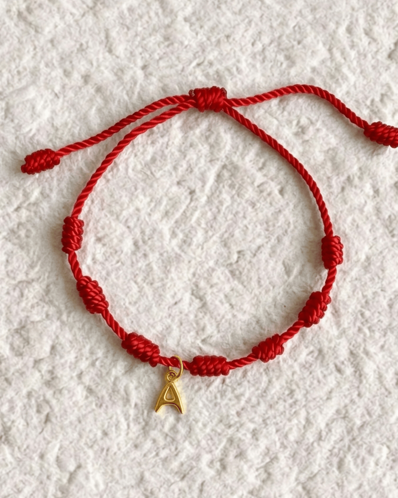 LUCKY KNOT BRACELET WITH ENGRAVED MEDAL