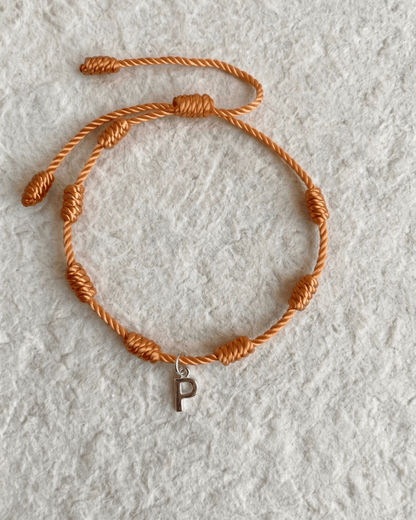 LUCKY KNOT BRACELET WITH ENGRAVED MEDAL
