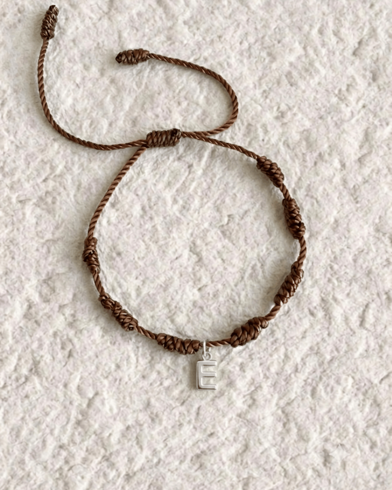 LUCKY KNOT BRACELET WITH ENGRAVED MEDAL