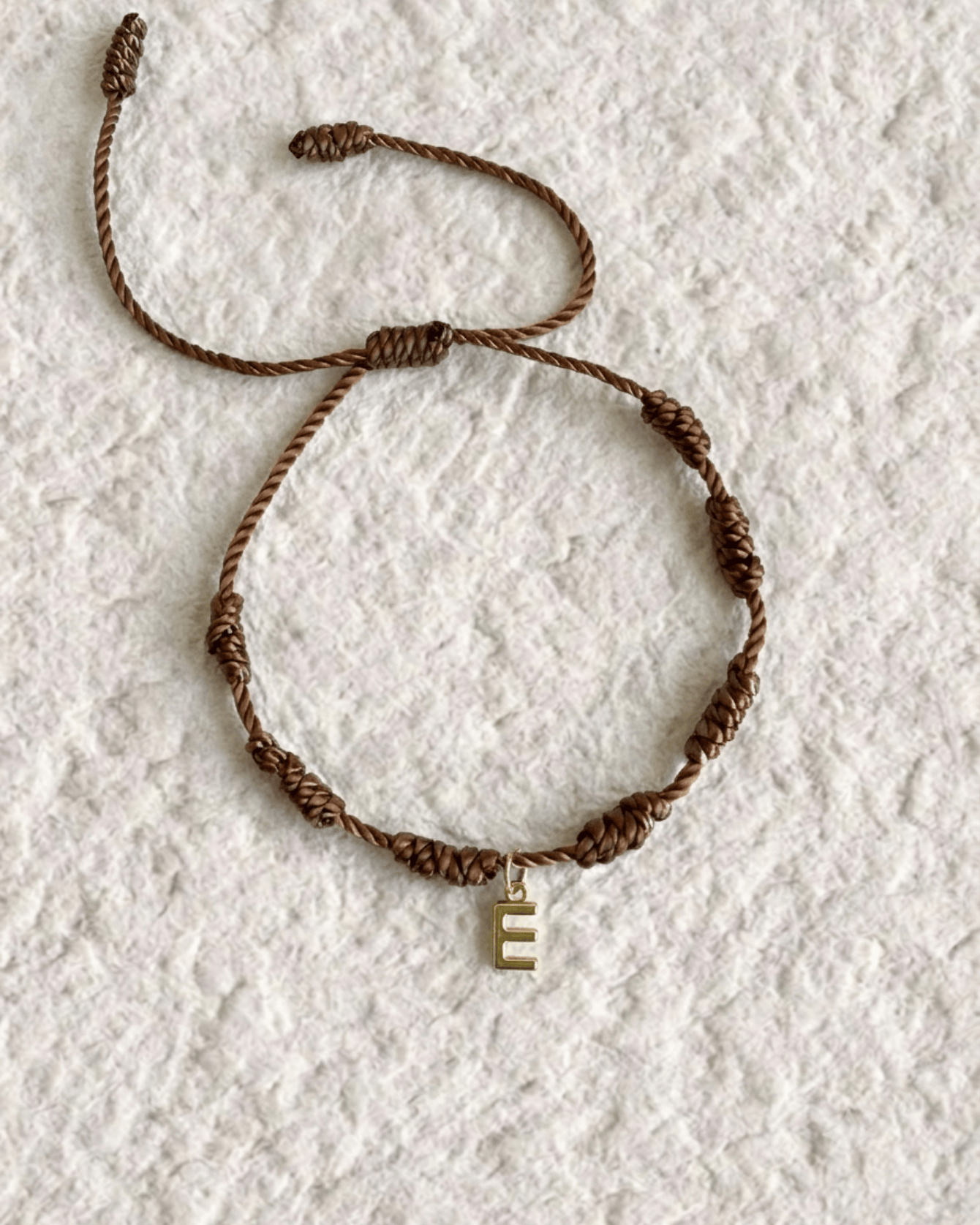 LUCKY KNOT BRACELET WITH ENGRAVED MEDAL