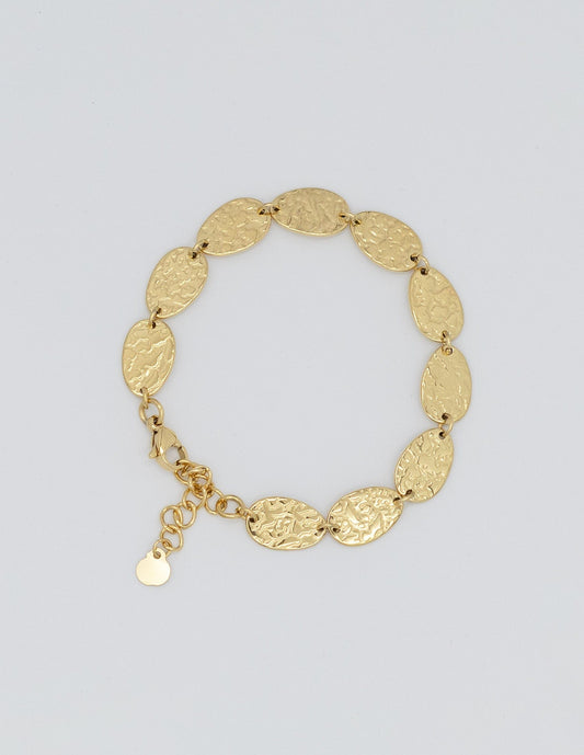 pulsera dorada con eslabones rellenos ovalados con textura maréele