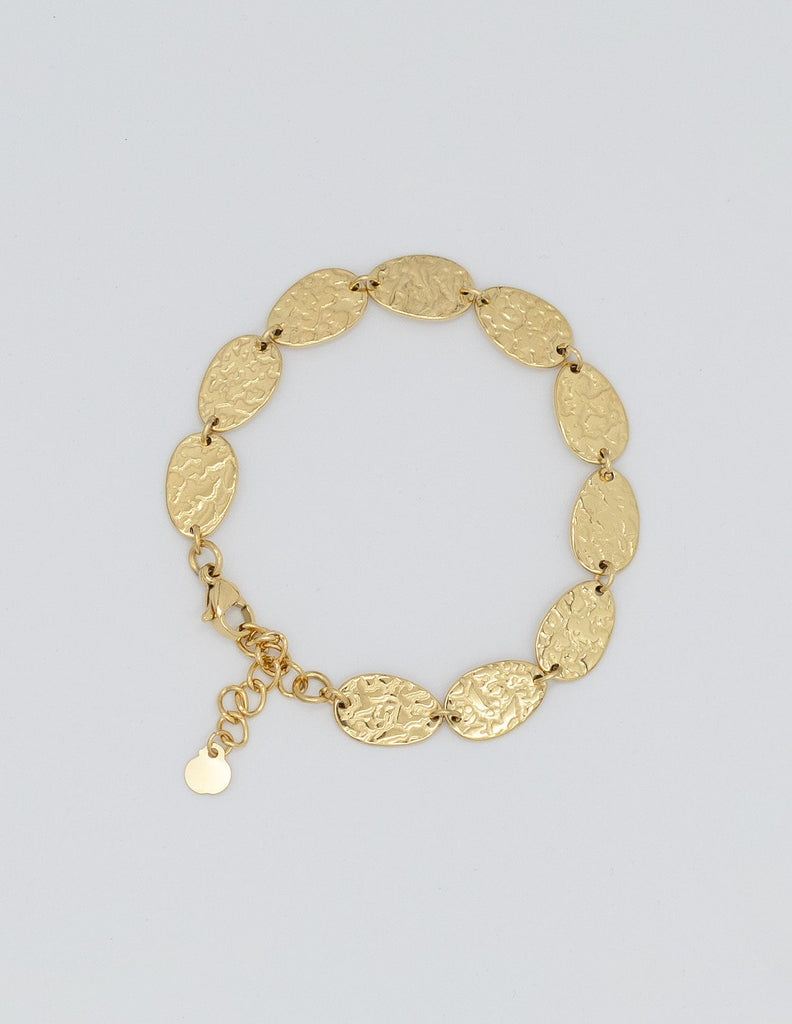pulsera dorada con eslabones rellenos ovalados con textura maréele